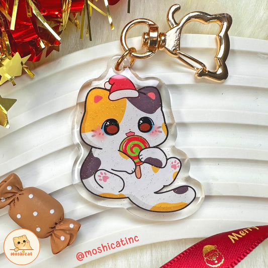 Kitty eating Christmas candy glitter keychain